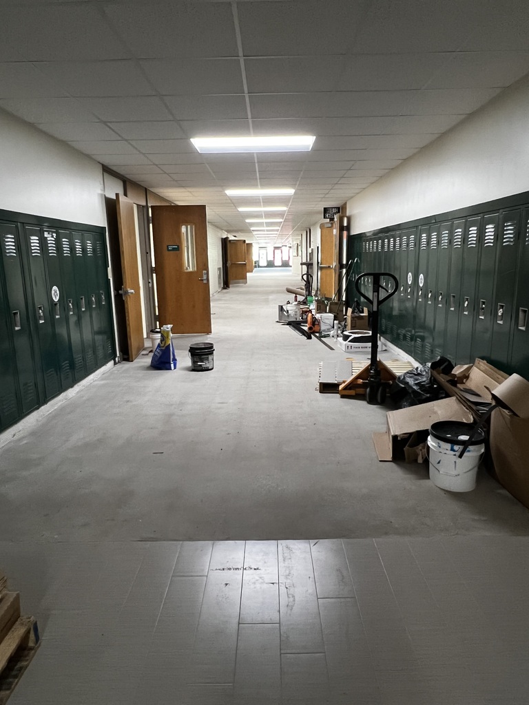 Hallway by music room showing flooring removed
