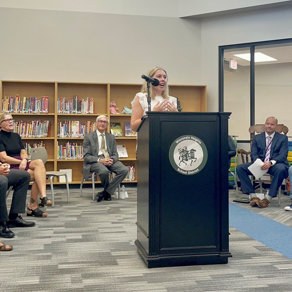 Eliza Gullickson speaking at podium